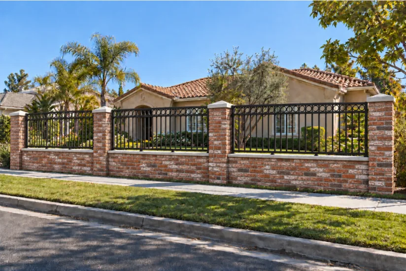 Reclaimed brick wall with double-rail ring-top black iron panels, front yard rendering