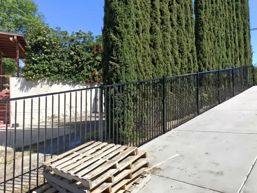 Wrought iron driveway gate and fence by Apexguard Fence