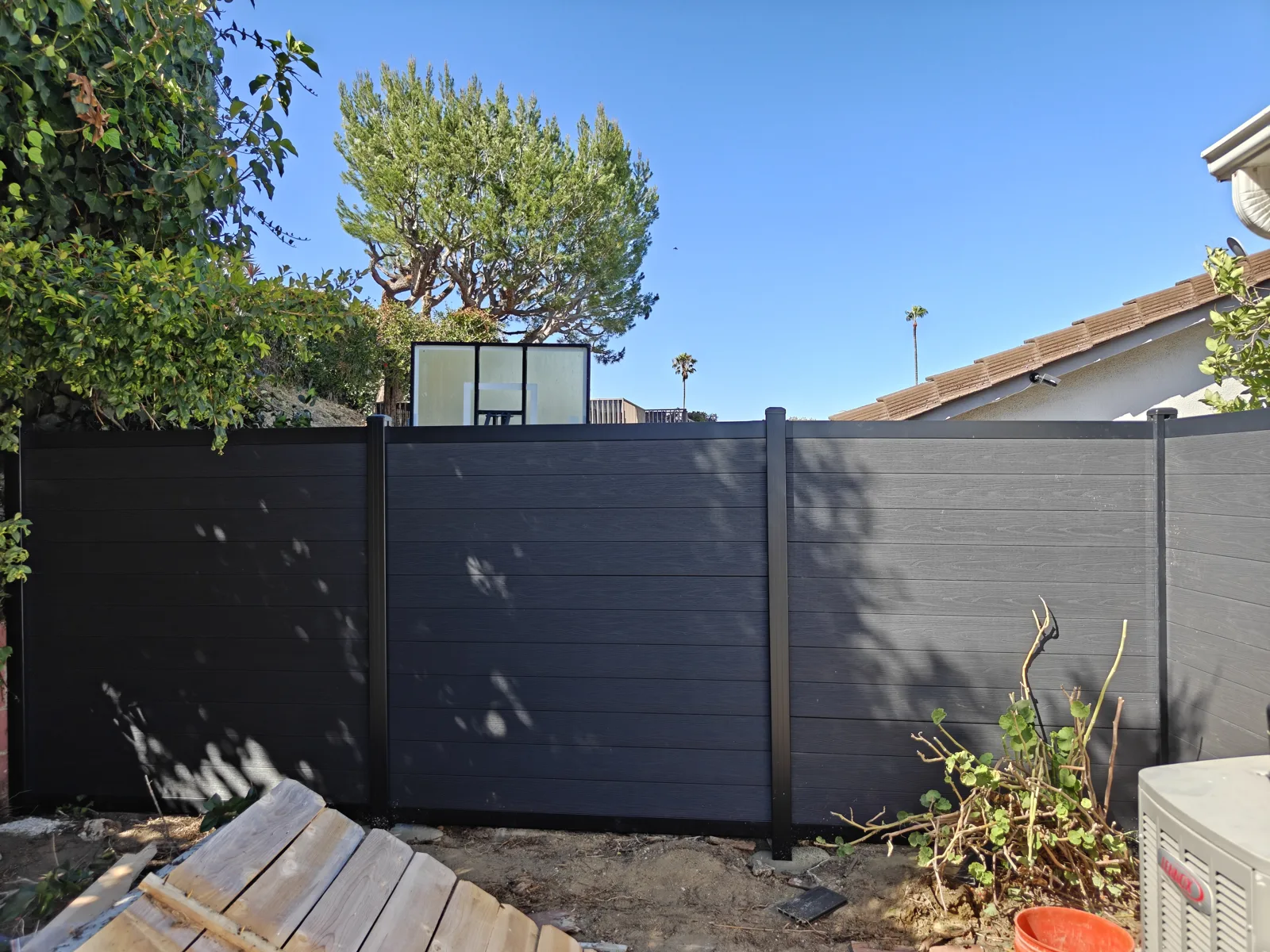 Charcoal composite WPC fence in a Los Angeles backyard by Apexguard Fence