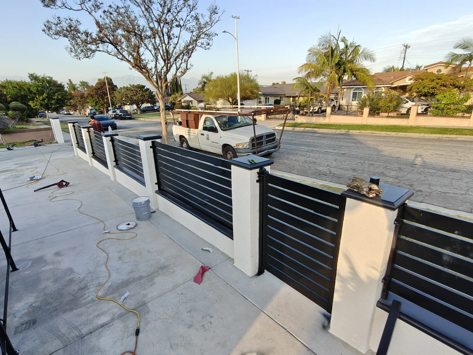 Modern CMU wall and horizontal slat fence wrapping a corner lot in La Puente, CA by Apexguard Fence