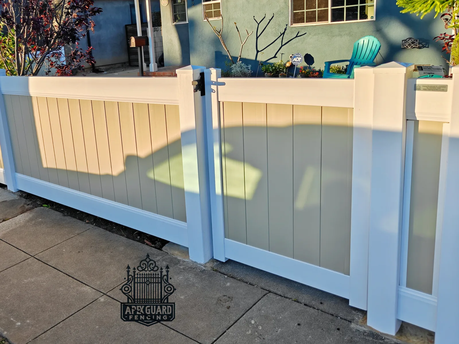 Two-tone vinyl fence with lattice top installed by Apexguard Fence in Baldwin Park, CA