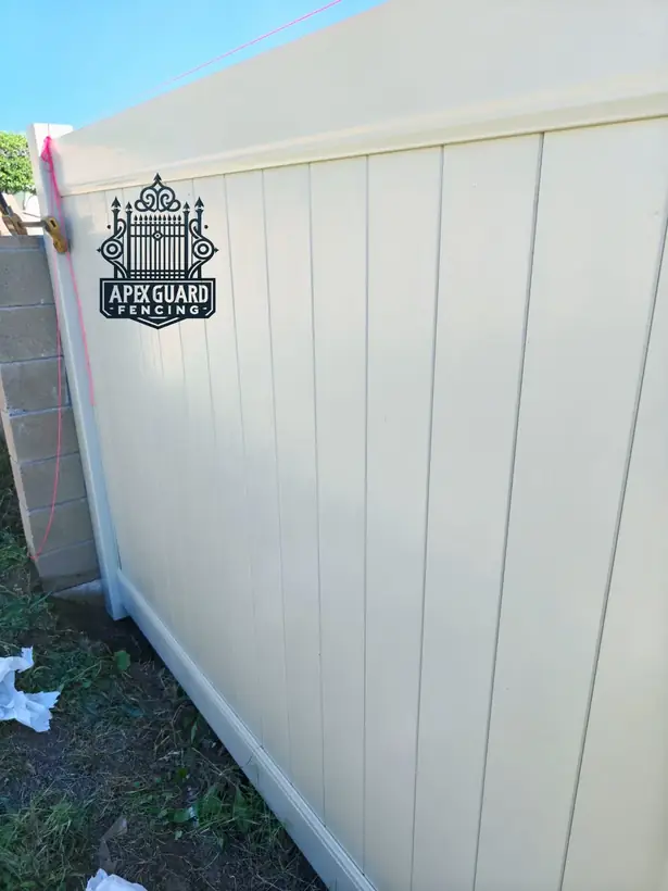 White vinyl privacy fence by Apexguard Fence, about $30 to $60 per foot