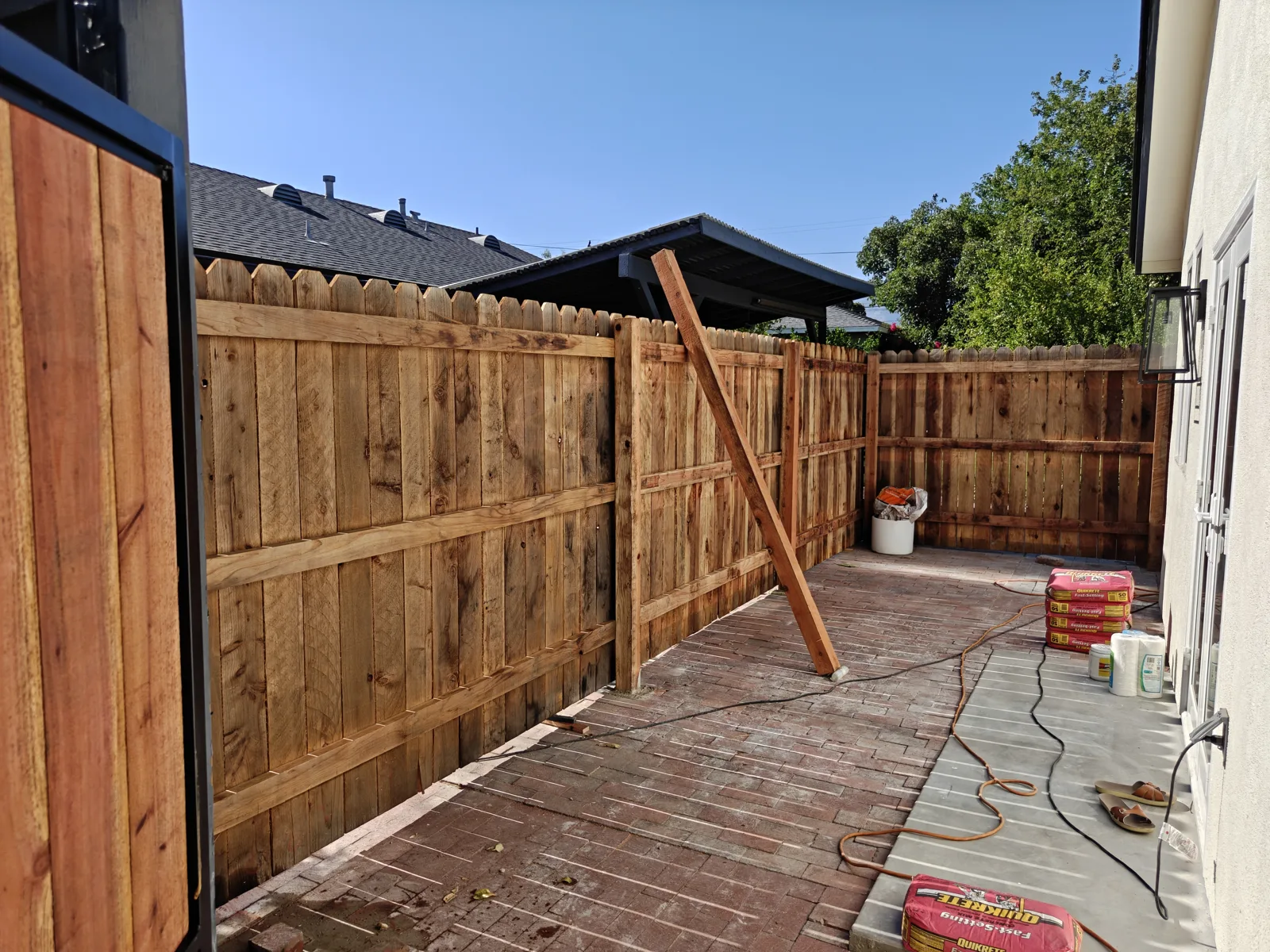 Long run of new dog-ear wood privacy fencing along a side yard in Claremont, CA by Apexguard Fence